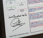 A framed British Grand Prix 2025 race commentary notes print displayed on a windowsill. The poster features a detailed grid with handwritten notes in red and blue marker, signed by David Croft, and is enclosed in a black frame.
